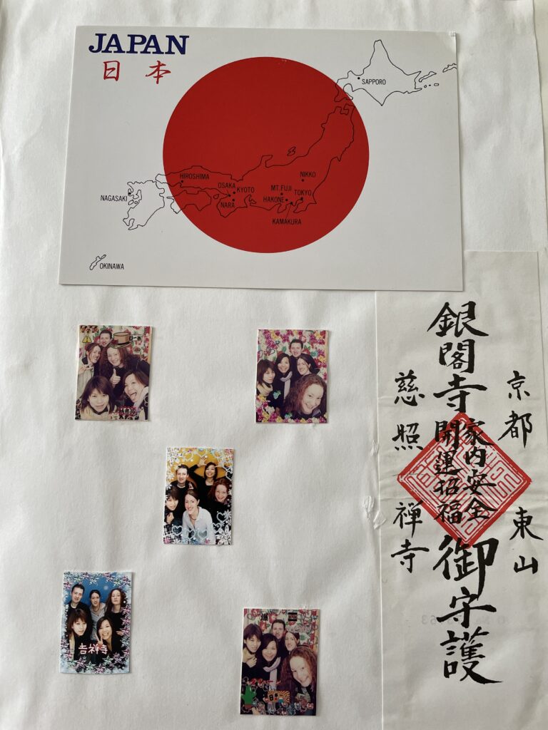 Scrapbook page showing a Japanese map postcard, a bookmark with Japanese symbols and some small photo booth group photos in various poses
